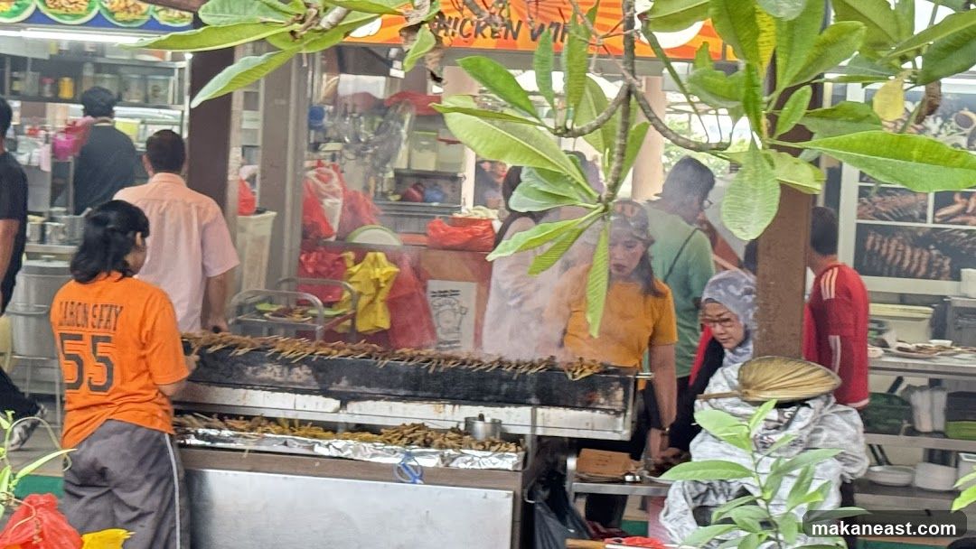 Street food stall with grilling skewers