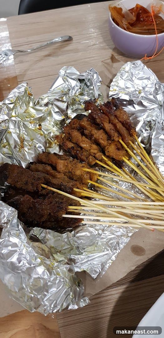 Skewers of meat with dipping sauce