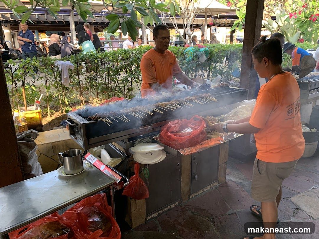 Street Food Vendor Grilling Satay