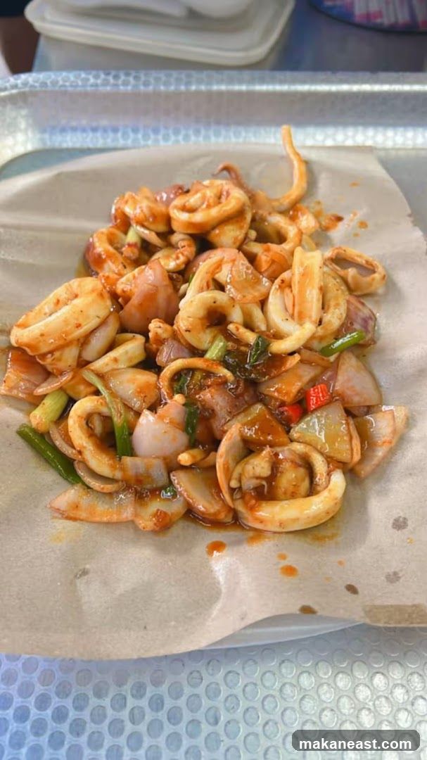 Spicy Stir-Fried Squid with Onions and Scallions