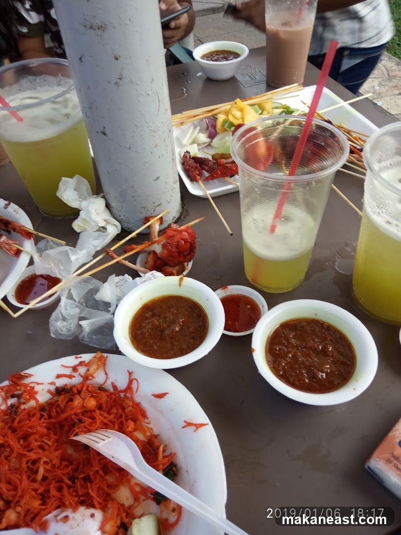 Outdoor Dining with Skewers and Drinks