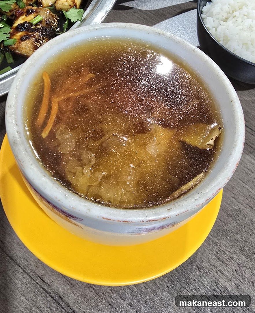 Bowl of Soup with Sliced Carrots