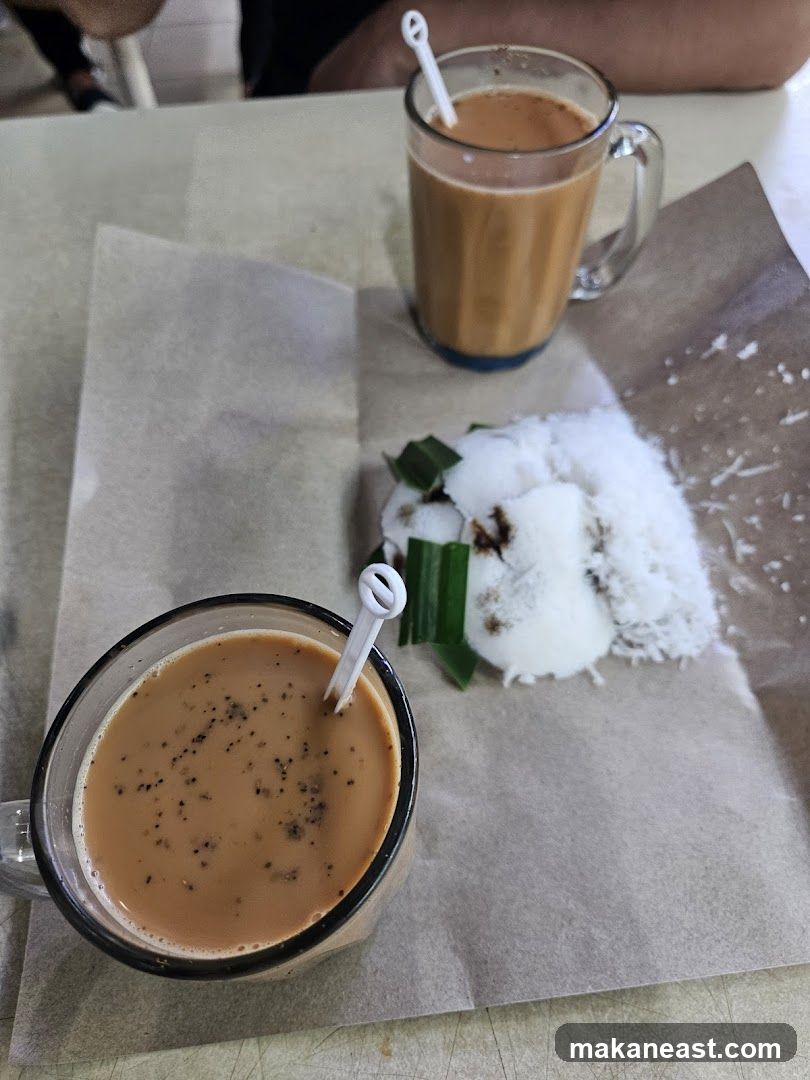 Two cups of tea and a dessert