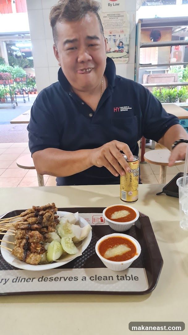 Man with Satay and Drink