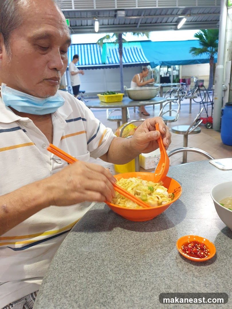 Man eating noodles