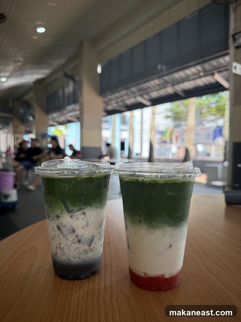 Two layered drinks on a wooden table