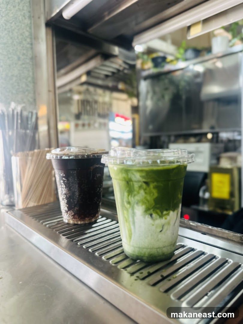 Two iced drinks on a metal surface