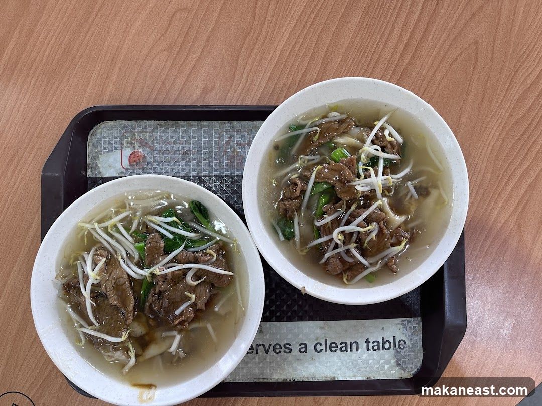 Two bowls of beef noodle soup