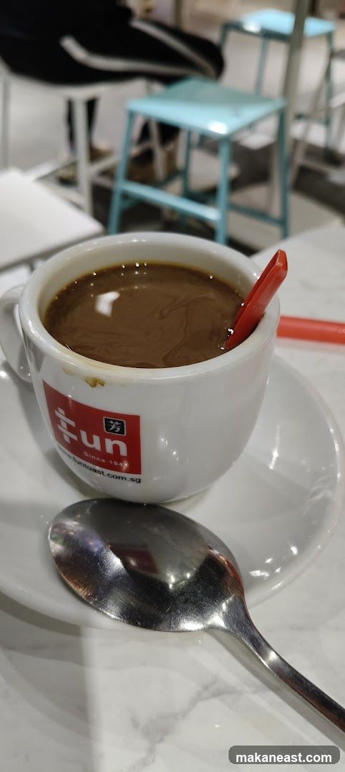 Coffee with a red stirrer