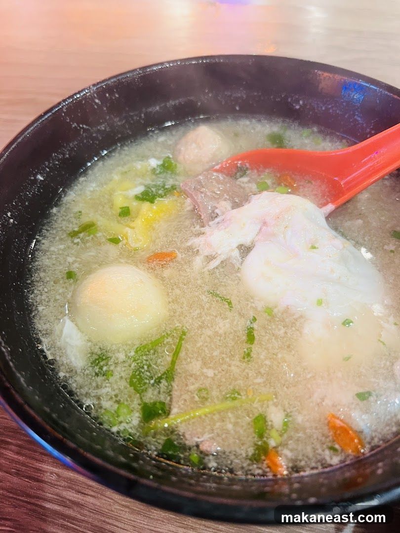 Bowl of Soup with Meatballs and Egg