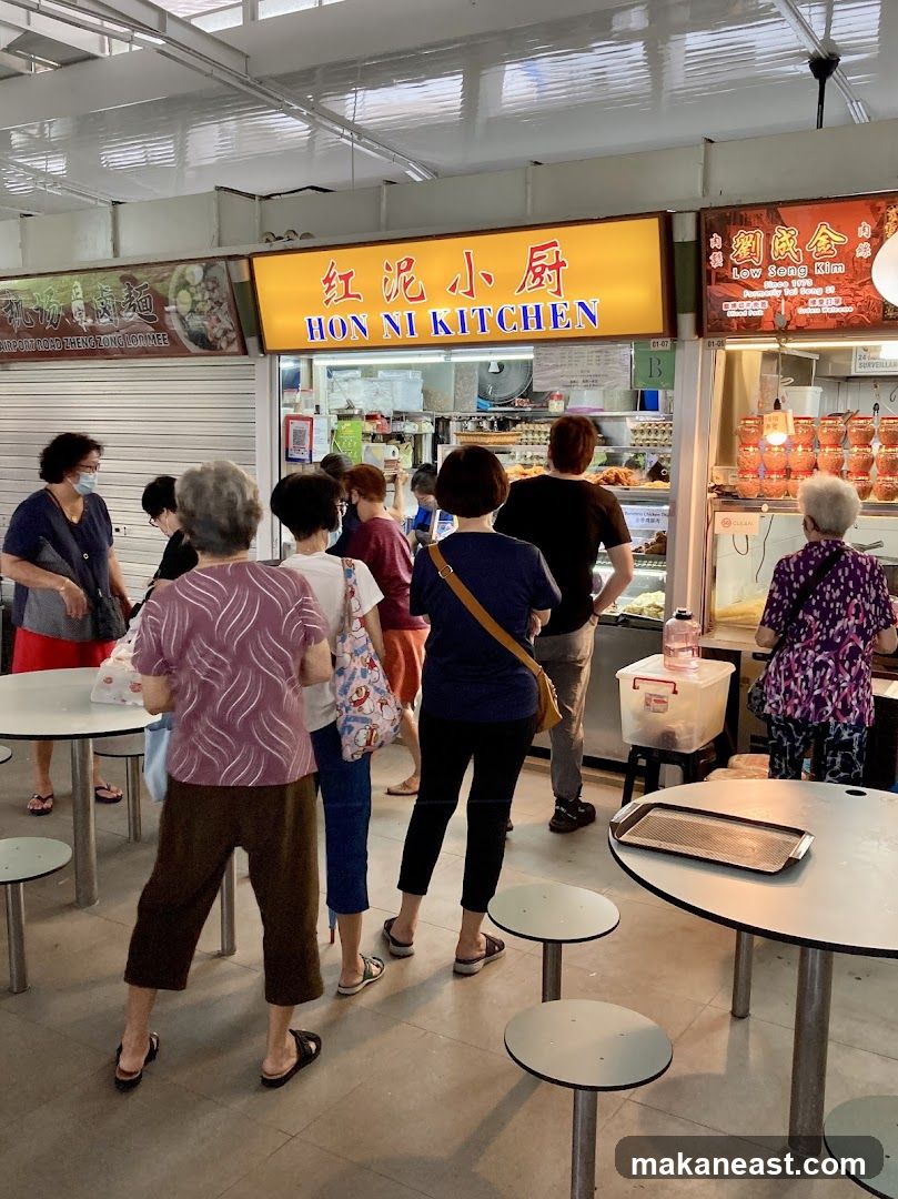 People queuing at a food stall