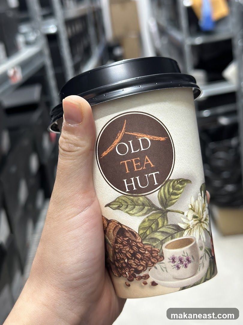 Coffee cup with Old Tea Hut logo