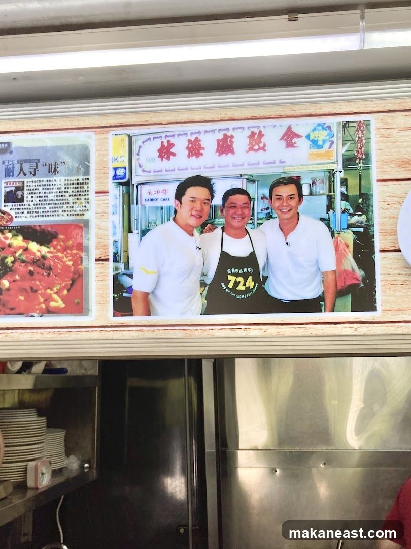 Three Men Posing in Front of a Food Stall
