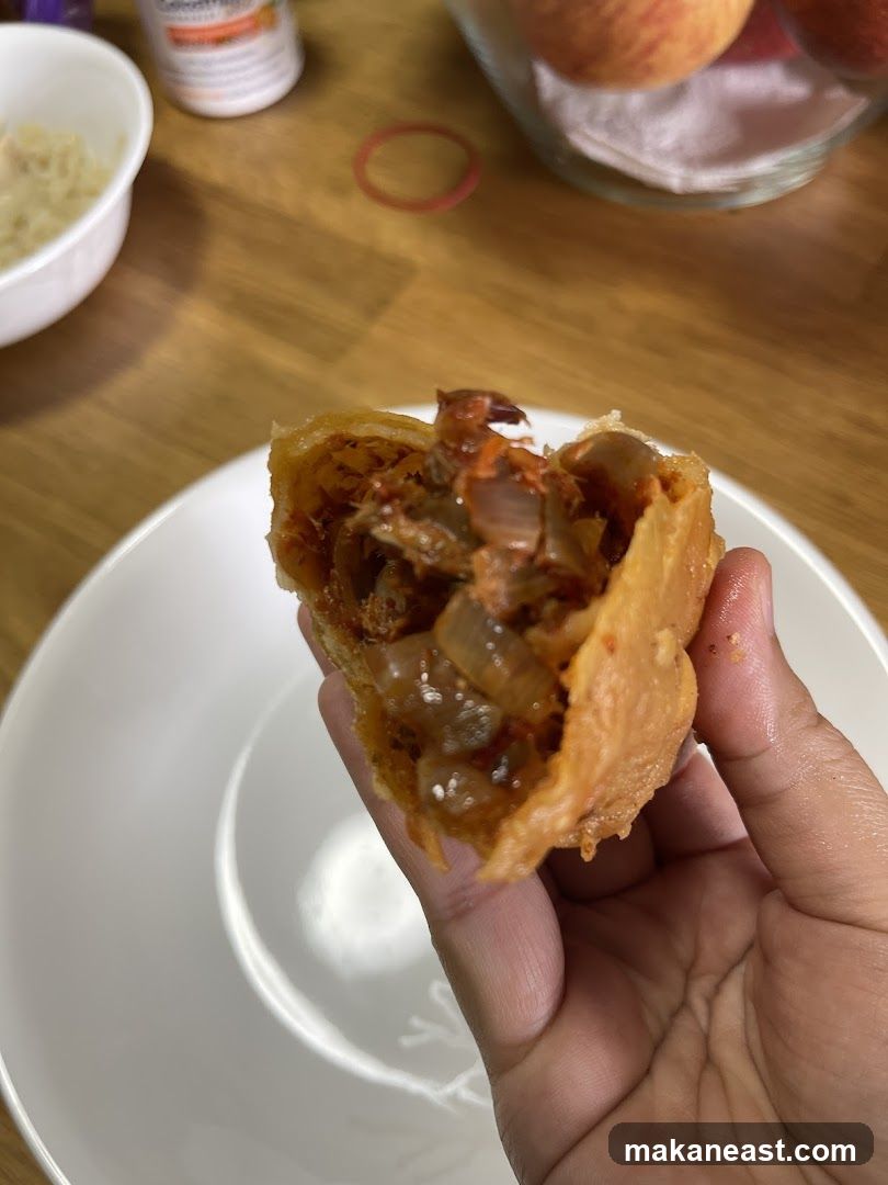 Hand holding a savory pastry