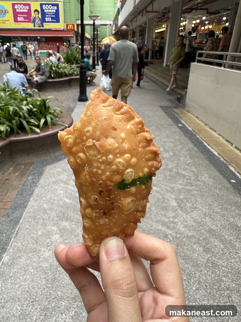 Hand holding a savory pastry
