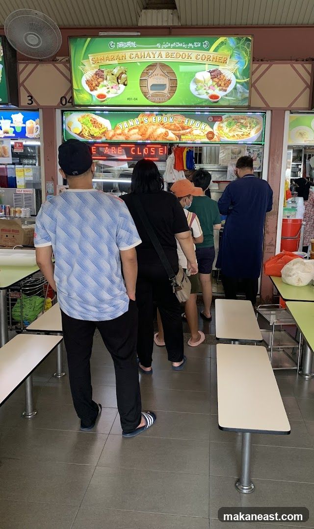 Food stall with customers queuing