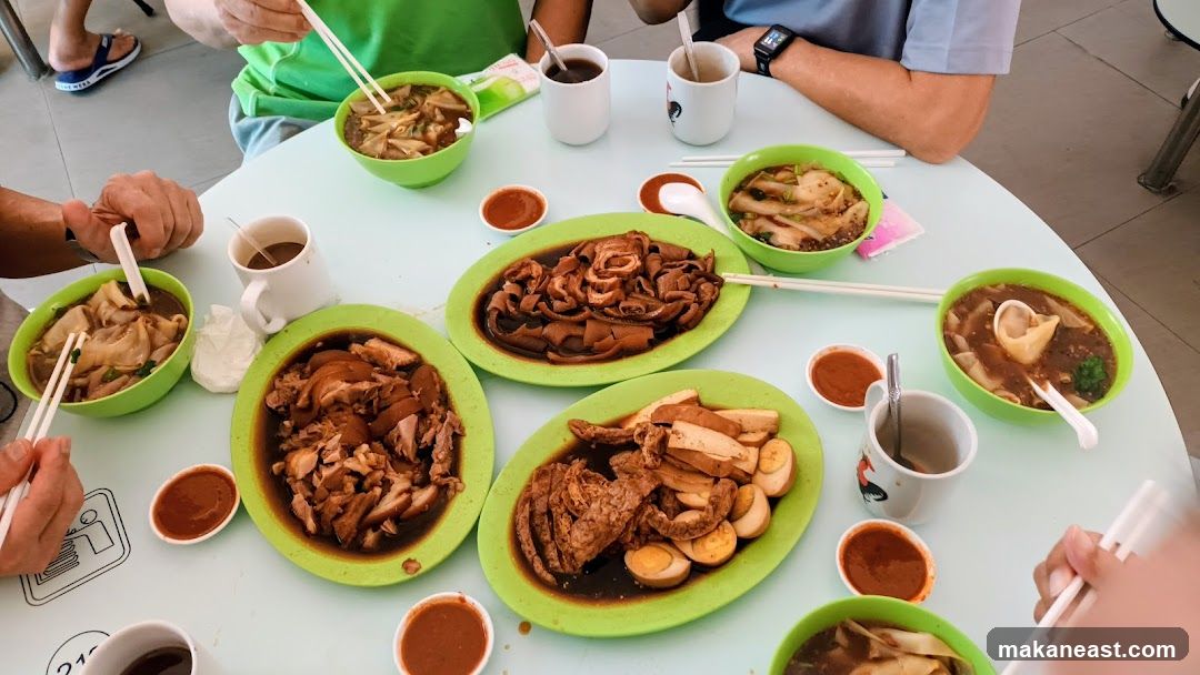 Table with Braised Meats and Noodles