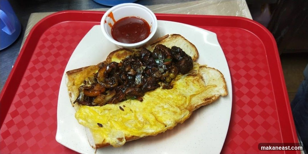 Open-faced sandwich with egg and meat topping