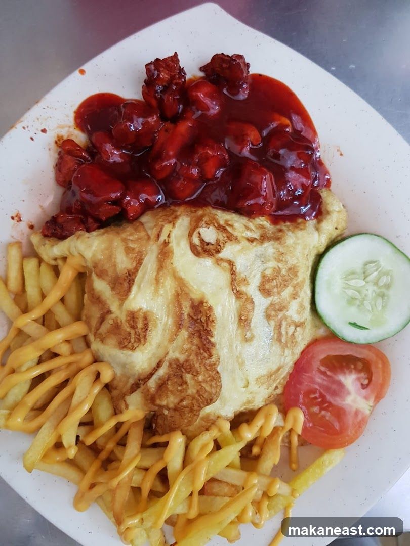 Chicken with Sauce, Fries, and Egg