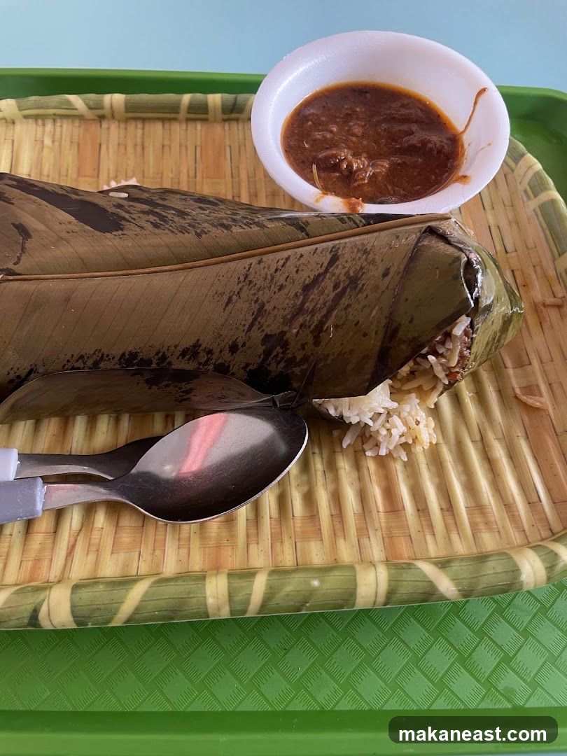 Food Wrapped in Banana Leaf with Dipping Sauce