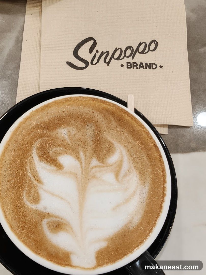 Latte with "Sinpopo BRAND" Napkin
