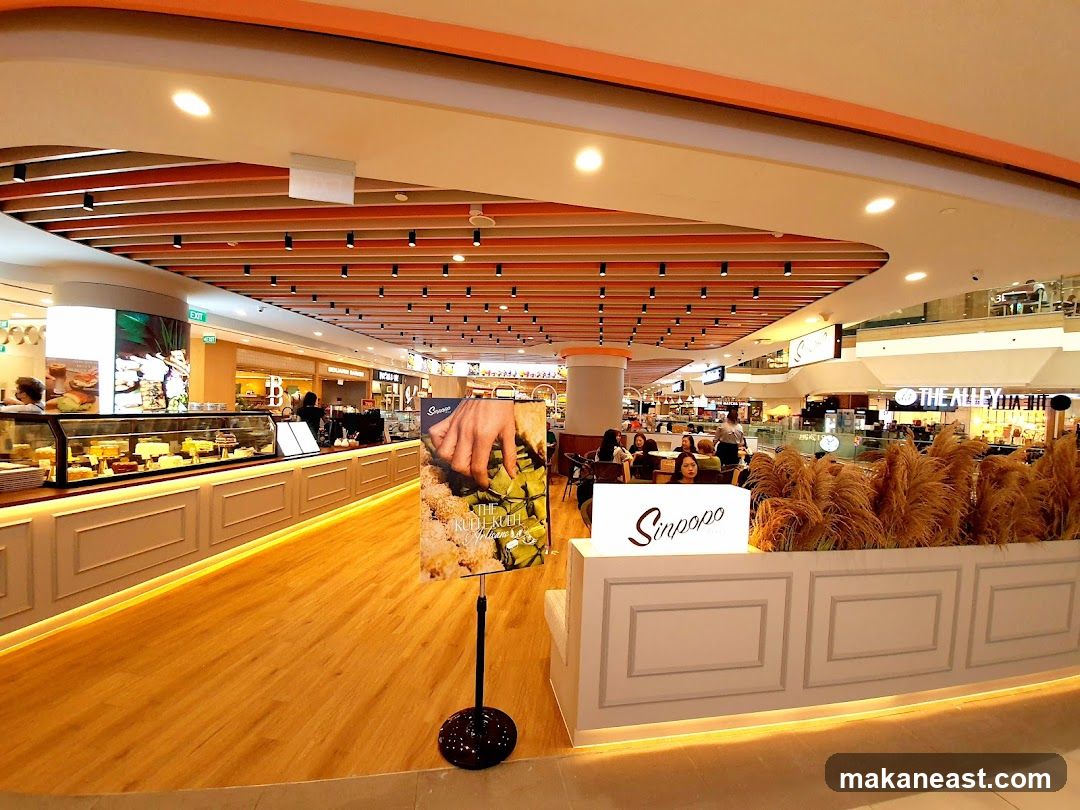 Dessert shop interior with display cases and seating