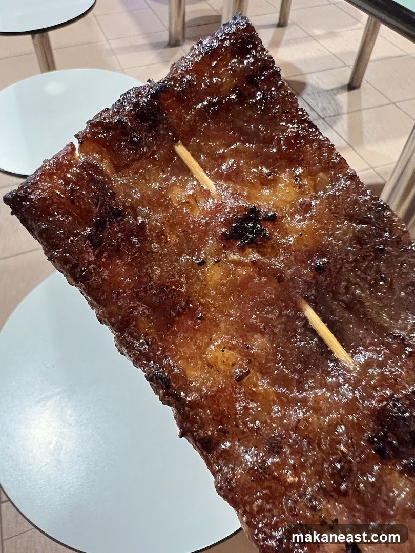 Close-up of a glazed meat skewer