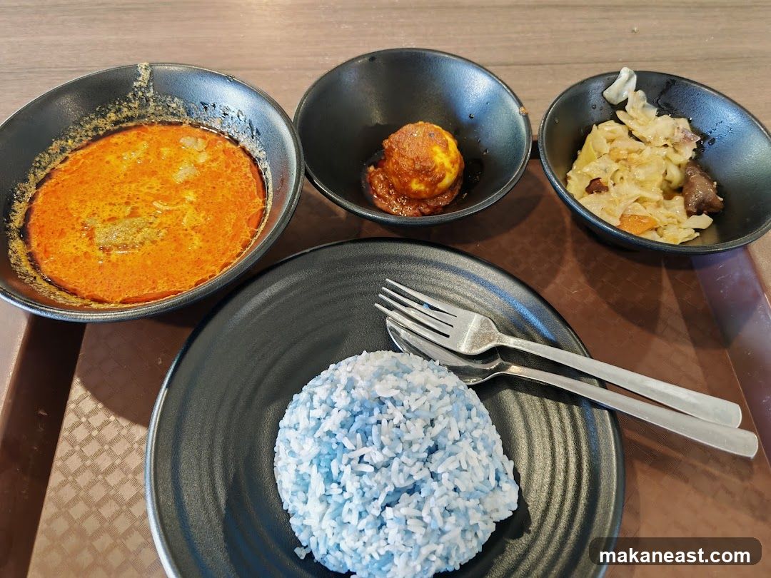Nasi Kerabu with side dishes