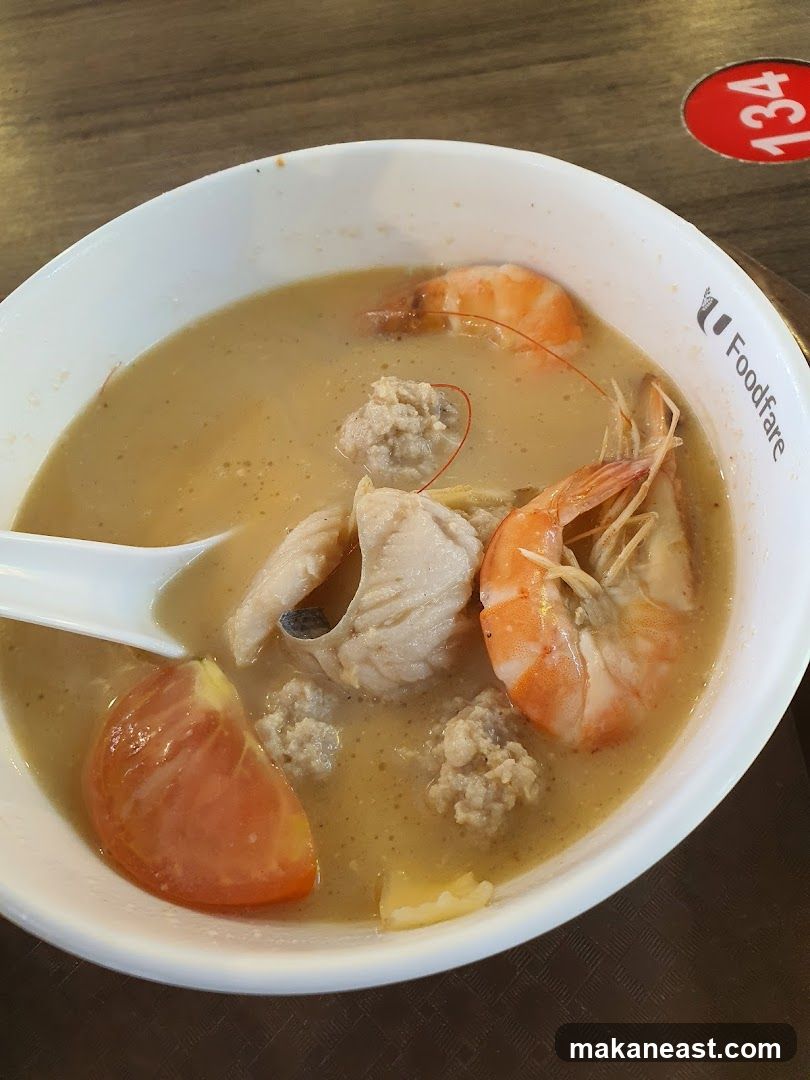 Bowl of Soup with Seafood and Meatballs