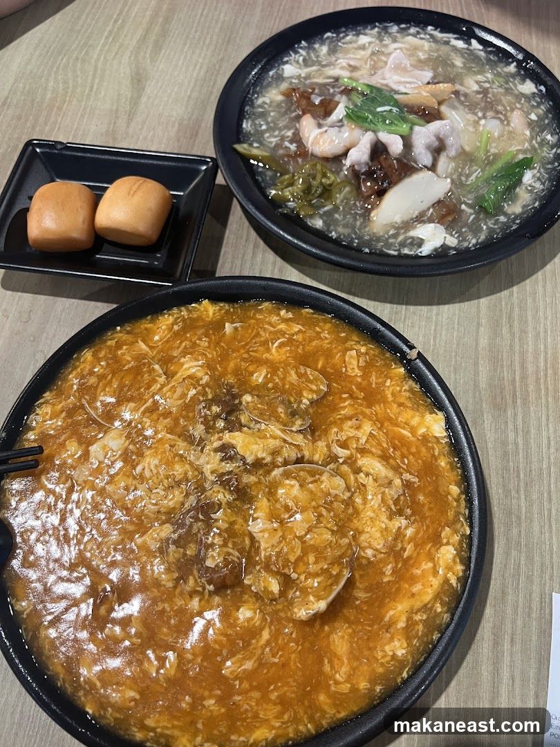 Two bowls of food with mantou