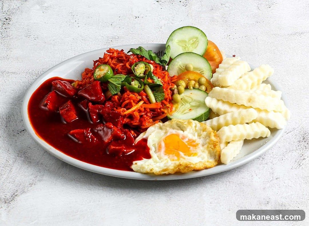 Spicy Noodle Dish with Fried Egg and Fries