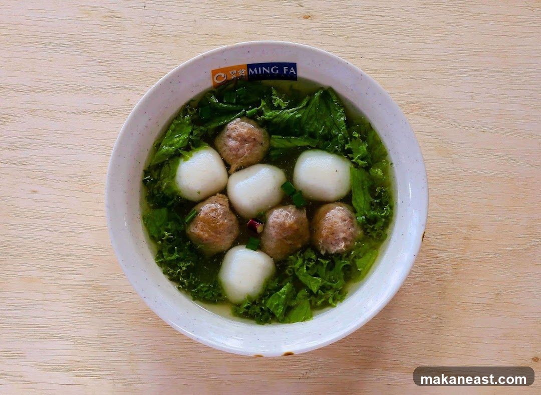 Bowl of Soup with Meatballs and Greens