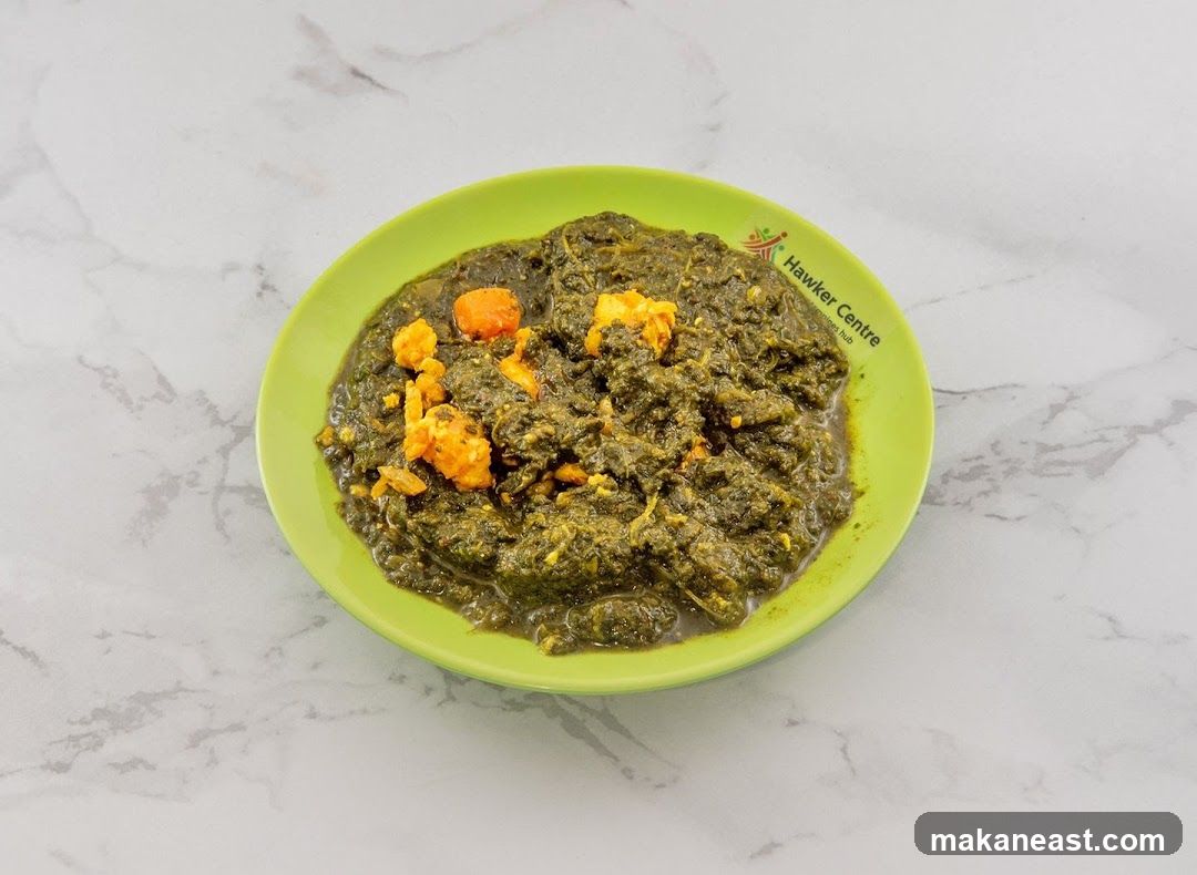 Palak Paneer on a Green Plate