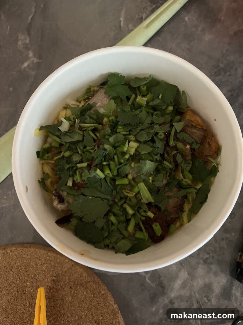 Bowl of Noodles with Meat and Herbs