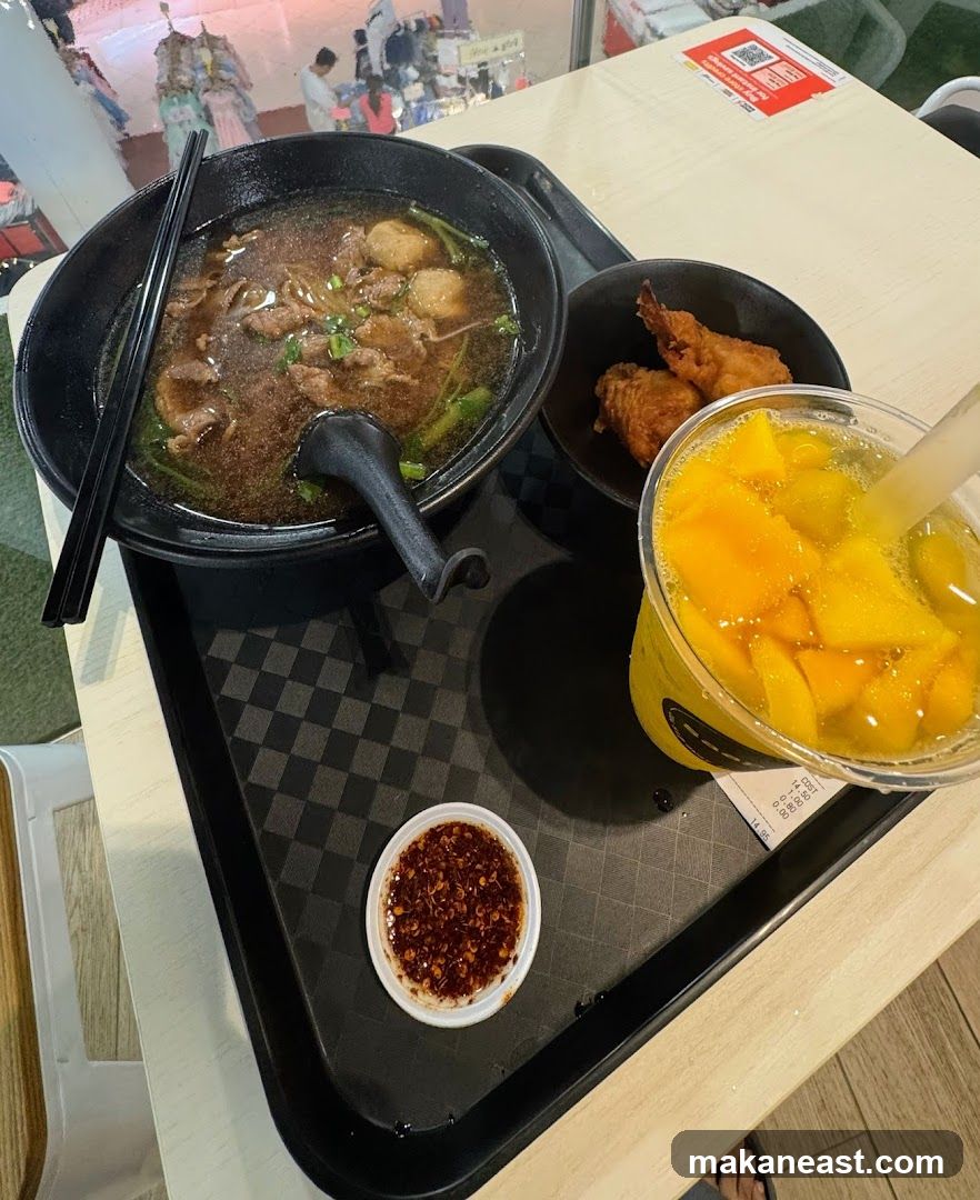 Meal Tray with Noodles, Fried Chicken, and Mango Drink