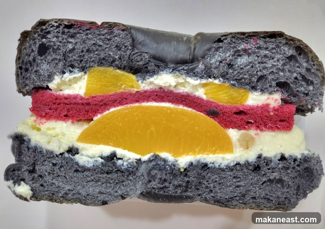 Black Bagel Sandwich with Fruit and Cream