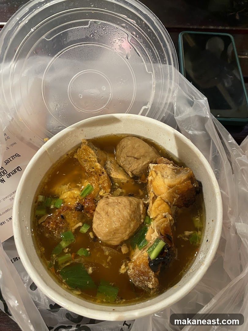 Bowl of Soup with Meatballs and Chicken