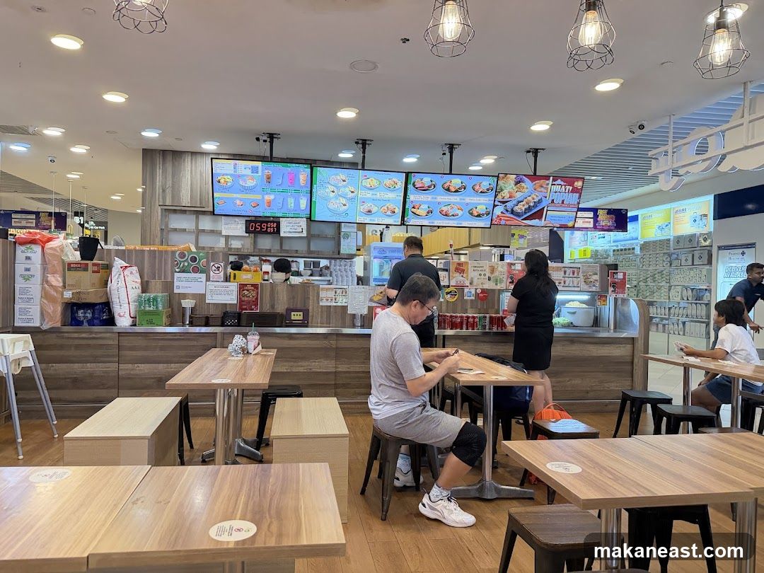 Food court interior with digital menus and seating