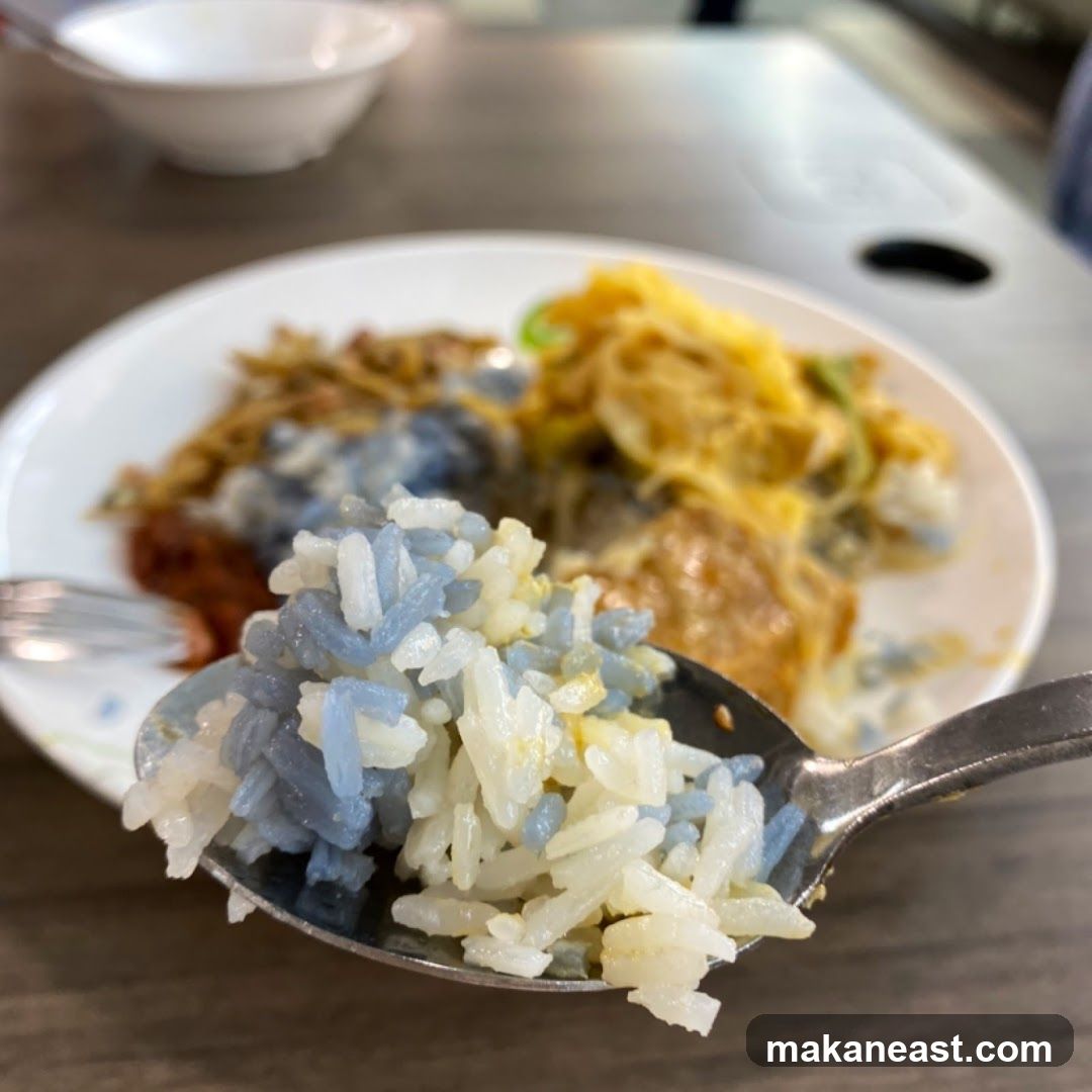 Close-up of Nasi Kerabu on a Spoon
