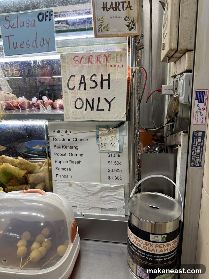 Food stall with menu and cash only sign