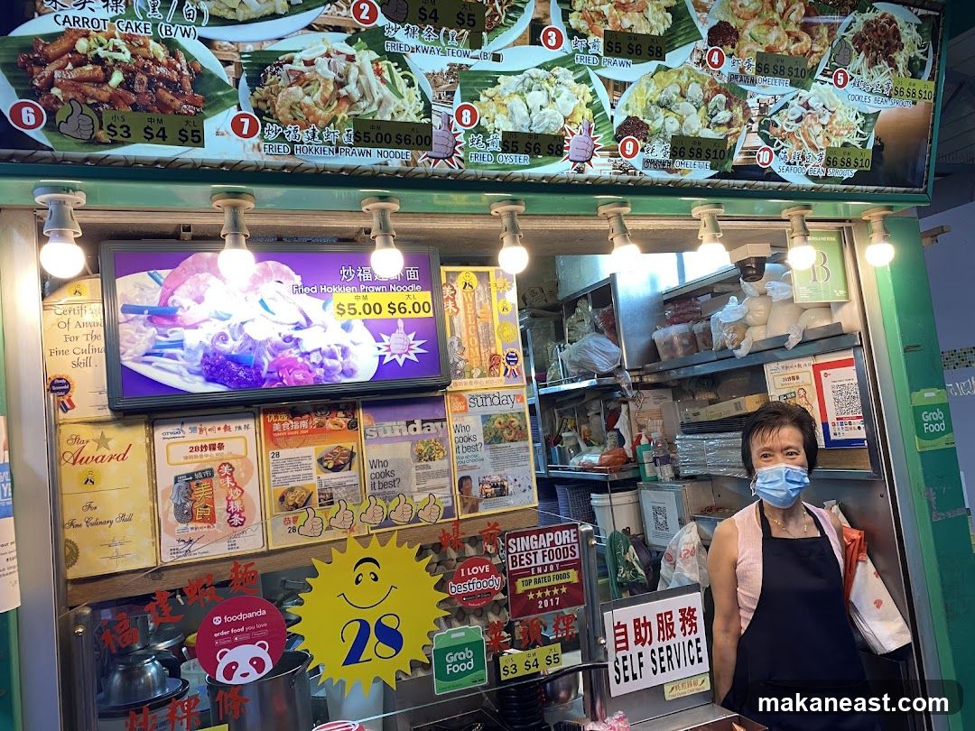 Food stall with menu and staff