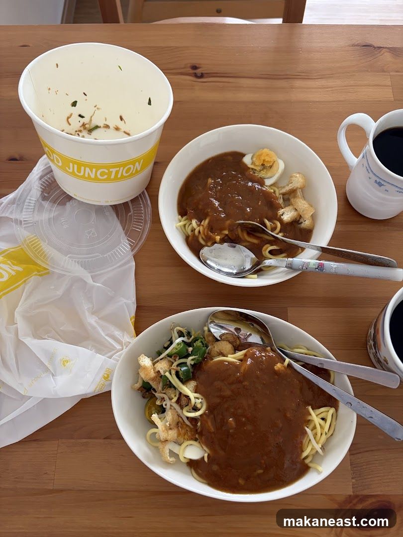Two bowls of noodles with sauce and coffee