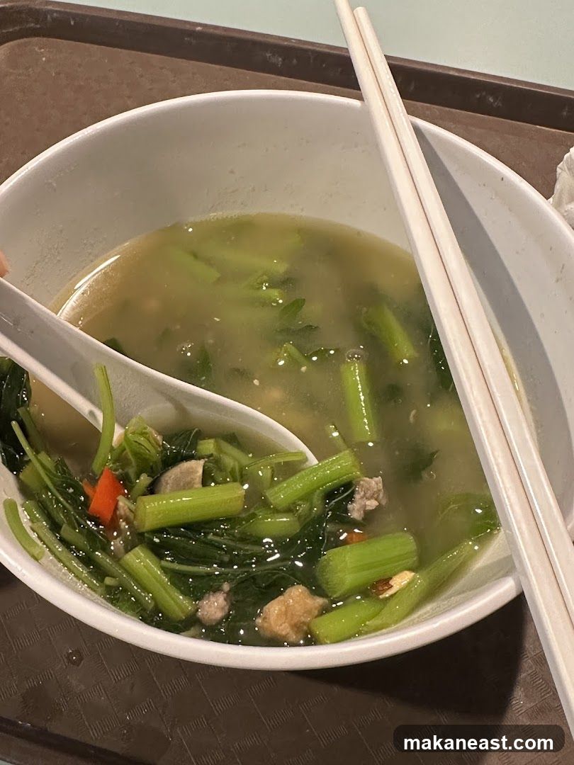Bowl of Soup with Vegetables and Meat