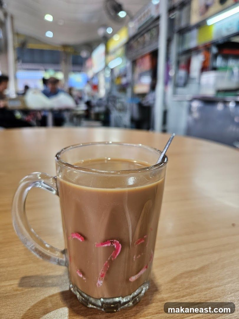 Coffee with milk in a glass mug