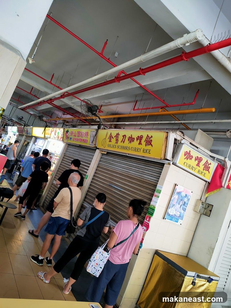 Food stalls with signage and customers