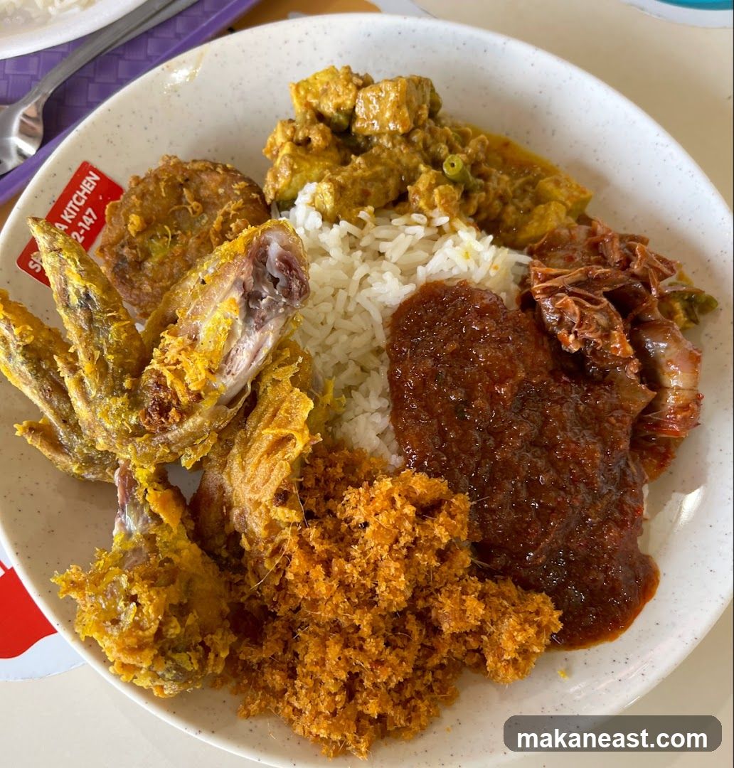Plate of food with fried chicken wings and rice