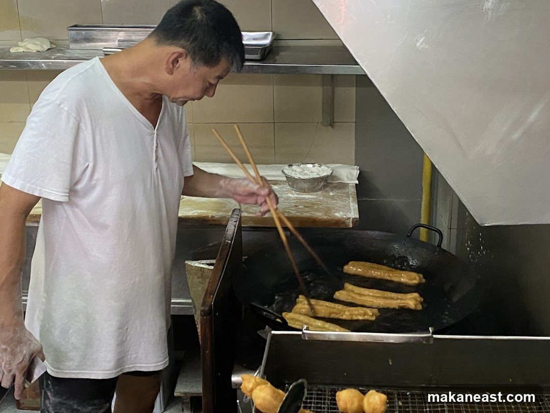 Man Frying Dough Sticks