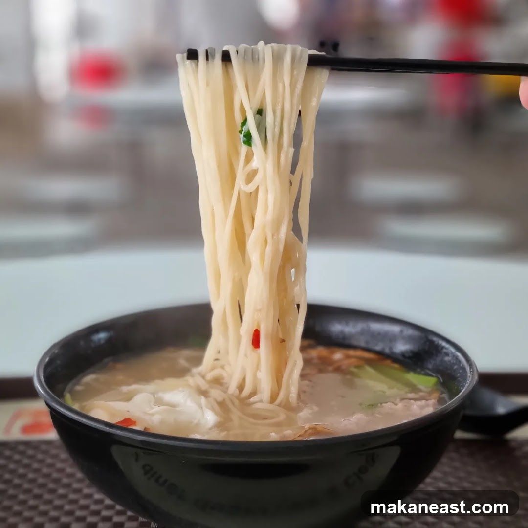 Noodles being lifted from a bowl