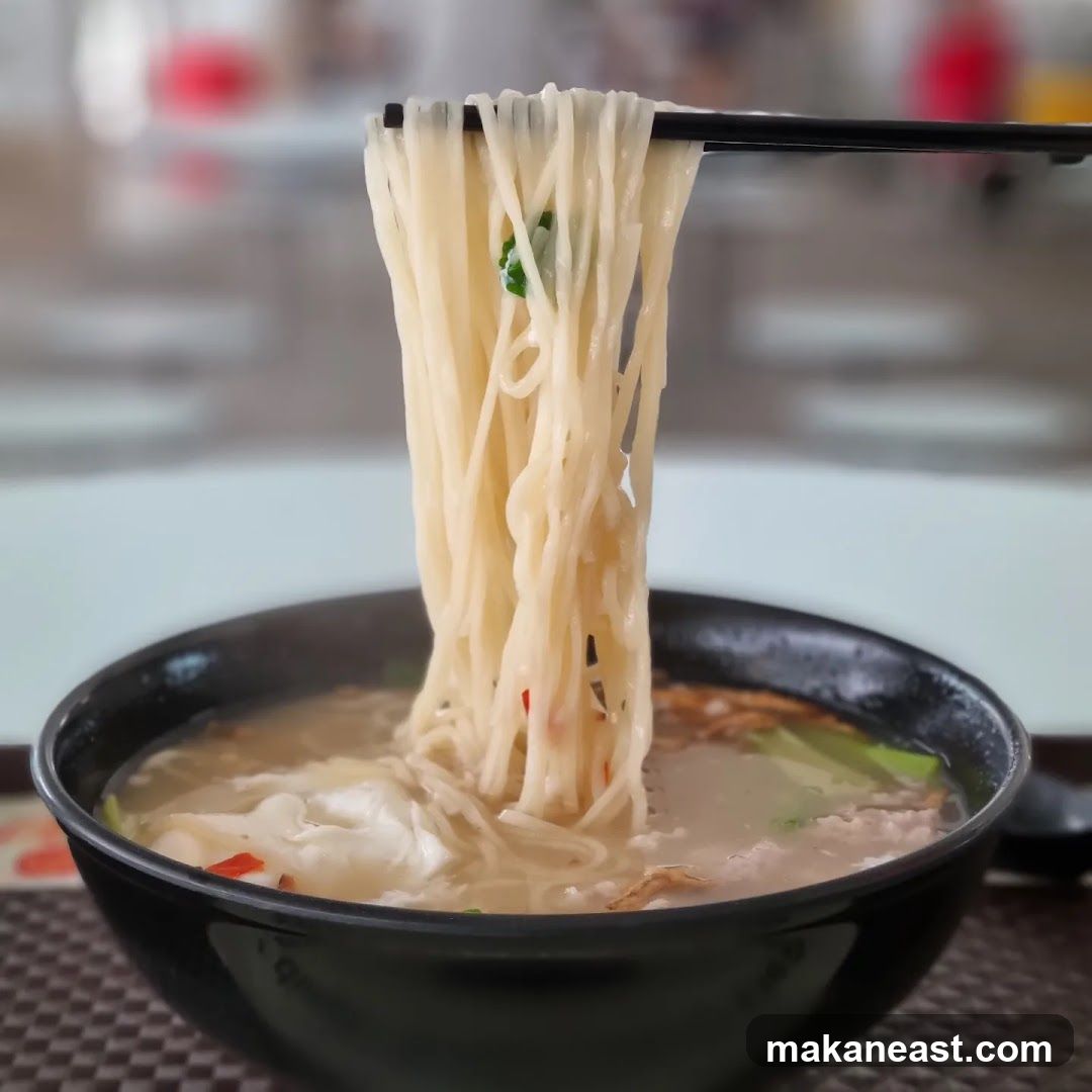 Noodles being lifted from a bowl