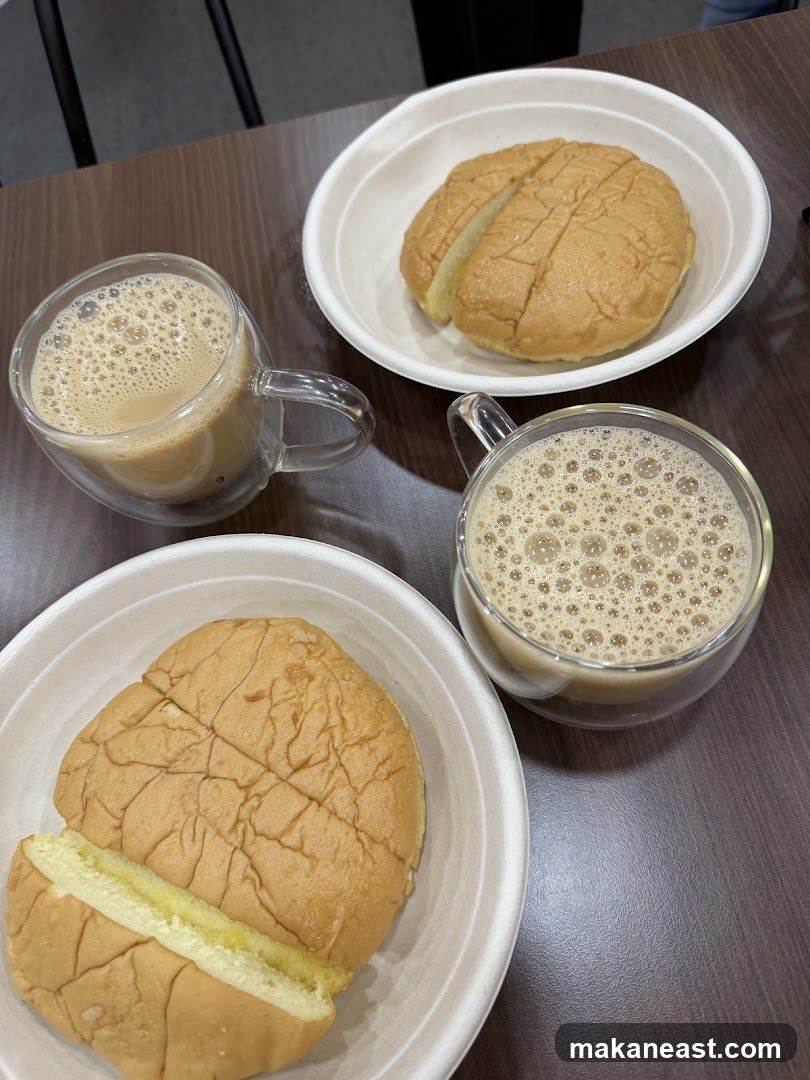 Two cups of milk tea with buns